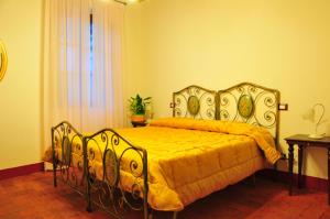 Postel nebo postele na pokoji v ubytování B&B Il Casale di Nanni