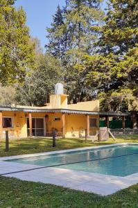 a house with a swimming pool in front of it at Casa de Campo La Renata in El Pato