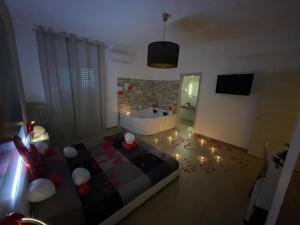 TV a/nebo společenská místnost v ubytování B&B La Perla & Suites
