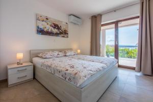 Posteľ alebo postele v izbe v ubytovaní Apartment in Crikvenica 34973