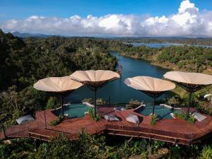 an aerial view of a lake with umbrellas at Bosko in Guatapé