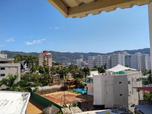 a view of a city from the roof of a building at IOW4 LM Junior Suite in Acapulco