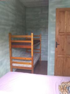 Ένα ή περισσότερα κρεβάτια σε δωμάτιο στο Pousada Plataforma