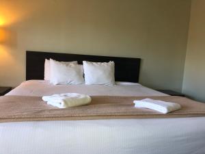 Postel nebo postele na pokoji v ubytování Hotel Elevation