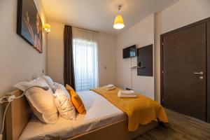 A bed or beds in a room at Forest corner in silver mountain of poiana brasov