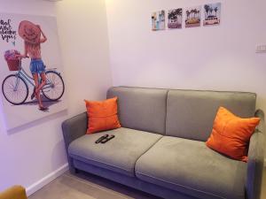 
a living room with a couch and a bicycle at House By The Beach in Eilat
