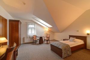 Postel nebo postele na pokoji v ubytování Hotel U Pramenu + 37 fotografií