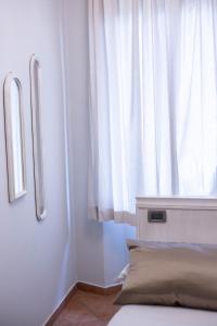 Postel nebo postele na pokoji v ubytování Residenza Florentia