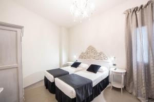 Postel nebo postele na pokoji v ubytování Residenza Florentia