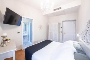 Postel nebo postele na pokoji v ubytování Residenza Florentia