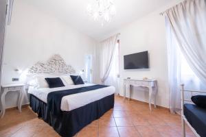 Postel nebo postele na pokoji v ubytování Residenza Florentia