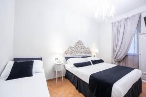 Postel nebo postele na pokoji v ubytování Residenza Florentia
