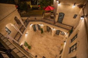 an overhead view of a building with a balcony at Sinasos Star Hotel in Ürgüp