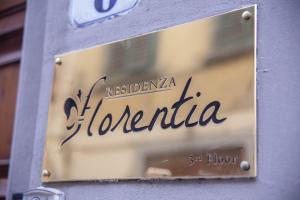 a sign for a florentina store on a building at Residenza Florentia in Florence
