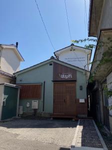 a building with a sign on the side of it at 松本はなれ in Matsumoto