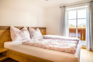 Postel nebo postele na pokoji v ubytování Biohof Untergrabenbauer