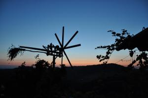 The sunrise or sunset as seen from a panziókat or nearby