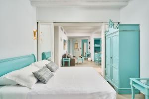 Кровать или кровати в номере Arte & Mare Elia Luxury Suites and Villas