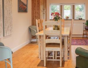 a dining room with a table and chairs at Lower Cross in Keighley