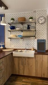 A kitchen or kitchenette at Apartamentos A Poniente