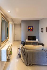 a living room with a couch and a television at Departamento Tucuman in San Miguel de Tucumán