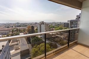 a balcony with a view of a city at Departamento Tucuman in San Miguel de Tucumán