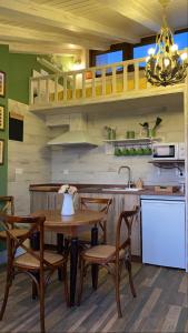 A kitchen or kitchenette at Apartamentos A Poniente