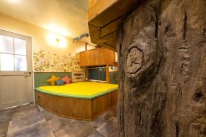 a bedroom with a bed in a wooden room at Holy House in Tokyo