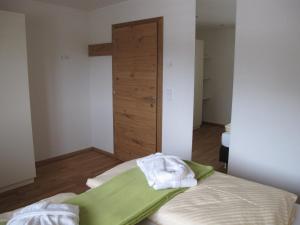 Letto o letti in una camera di Haus Kibitz