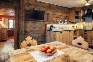 a kitchen with a bowl of fruit on a table at Bauernhof Wachter in Fiss