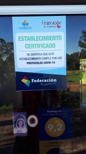a sign on the side of a window at Irundy Apartments in Federación