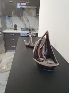 a pair of shoes sitting on a counter in a kitchen at MONAR City center apartment free parking in Košice