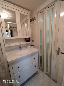 a bathroom with a sink and a mirror at Appartamento Via Filippini in Reggio Calabria