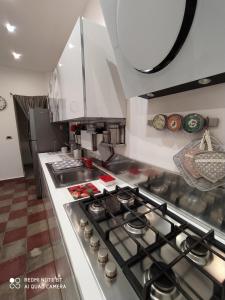 a kitchen with a stove top oven in a kitchen at Appartamento Via Filippini in Reggio Calabria