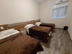 Ένα ή περισσότερα κρεβάτια σε δωμάτιο στο Bella Augusta Hotel