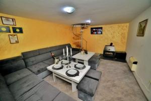 a living room with a couch and a table at Drinsko jutro in Bijeljina