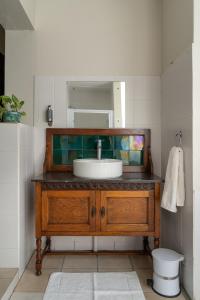 a bathroom with a sink and a mirror at Selborne Bed and Breakfast in East London