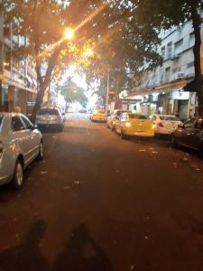 a group of cars parked on a city street at Copacabana Posto 6 até 3 pessoas in Rio de Janeiro