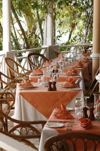 a long table set up for a meal at a restaurant at Coco Reef Resort & Spa in Crown Point