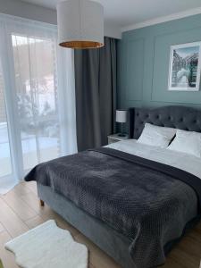Posteľ alebo postele v izbe v ubytovaní Apartament "OldMountain" Olimpijska 1C 1