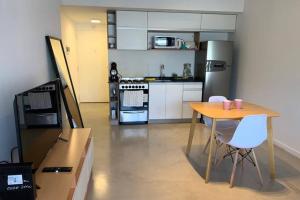 Cuina o zona de cuina de Amazing apartment with amenities