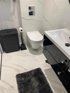 Kúpeľňa v ubytovaní Apartament "OldMountain" Olimpijska 1C 1