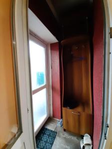 a mirror in a room with a window at Частный дом, р-н 3 городской больницы in Cherkasy
