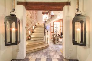 a hallway with a staircase in a house at Hotel Boutique Casa del Coliseo in Cartagena de Indias