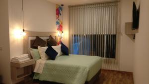 Postel nebo postele na pokoji v ubytování Hotel Aristo Gold