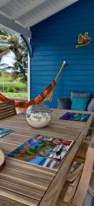 a wooden table with a bowl on top of it at BUNGALOW DE SAINT JACQUES in Saint-François