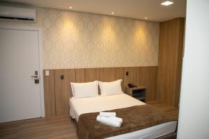 Cama ou camas em um quarto em Hotel Zunino