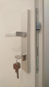 a door with a rusted key hanging from it at ABAI Apartments 1150 only WWW-On-line-Check-in & SelfService in Vienna
