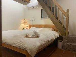 Krevet ili kreveti u jedinici u objektu 浯島 拾午15Home