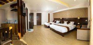 Een bed of bedden in een kamer bij Hotel Shaara